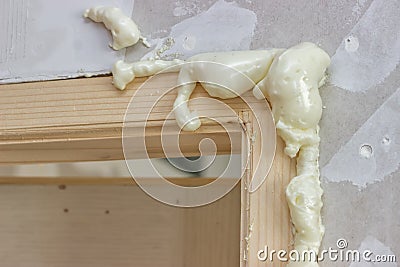 polyurethane-foam-around-door-frame-bonding-installation-saves-energy-stoping-air-moisture-infiltration-add-46498824.jpg