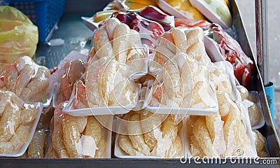 Pomelo pieces in plastic wrap