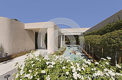 Pond And Walkway In Front Of Modern House