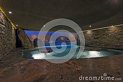 Pool With Stone Walls At Night