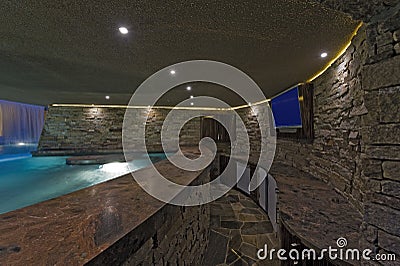 Pool With TV On Stone Wall