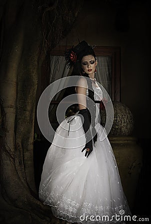 Poortrait of fantasy bride with hat and glovees