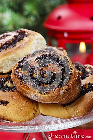 Poppy seed buns on cake stand. Christmas eve setting