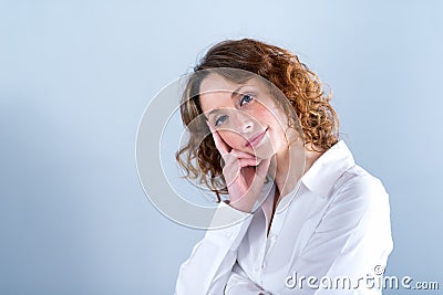 Portrait of an attracive young woman on light background