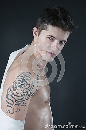 Portrait of attractive men with tattoo on shoulder