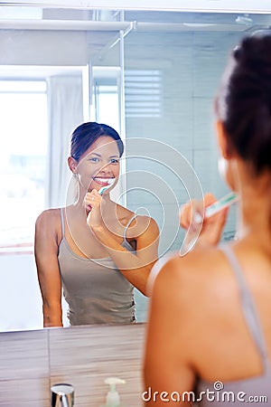 Woman brushing teeth