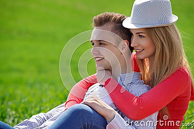 Portrait of attractive young couple in love outdoors.