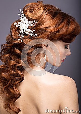 Portrait of a beautiful ginger woman in the image of the bride.