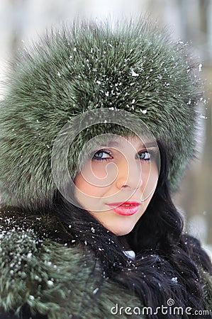 Portrait of beautiful girl in winter clothes