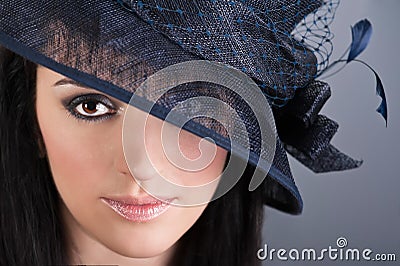 Portrait of beautiful woman in vintage hat