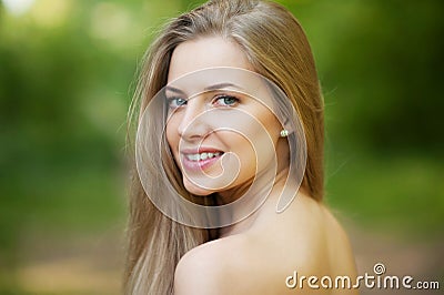 Portrait of beautiful young girl with clean skin on pretty face