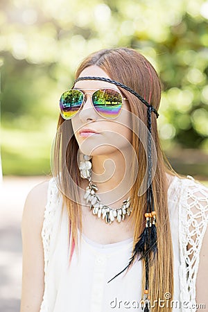 Portrait of beautiful young woman with sunglasses hippie style,