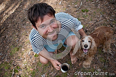 Portrait of a brutal bearded man with his dog