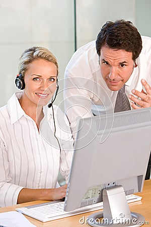 Portrait of business colleagues working on laptop