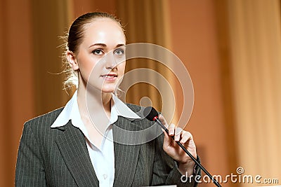 Portrait of a business woman with microphone