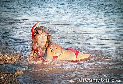 Portrait of caucasian girl at the beach with snorkeling mask and