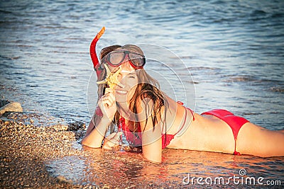 Portrait of caucasian girl at the beach with snorkeling mask and