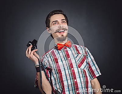 Portrait of a cheerful photographer