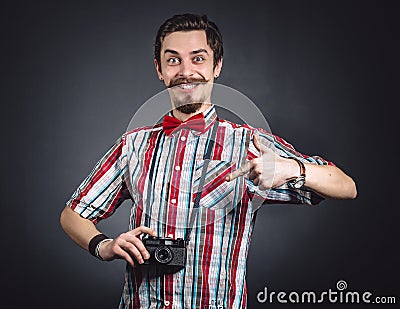 Portrait of a cheerful photographer