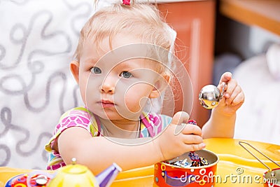 Portrait of child girl on kitchen. Use it for child, healthy food, infant formula