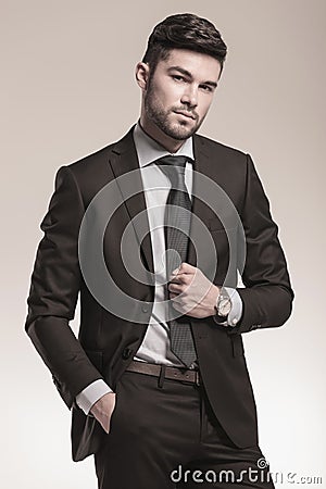 Portrait of a cool young business man posing