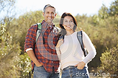 Portrait Of Couple Hiking In Countryside