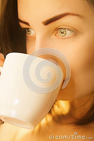 Portrait of cute woman with cup of coffee