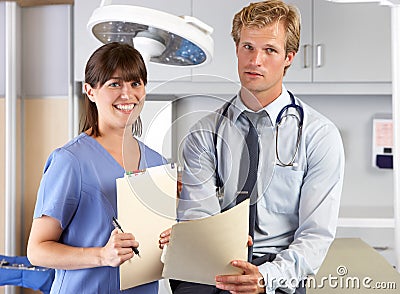 Portrait Of Doctor And Nurse In Doctor s Office