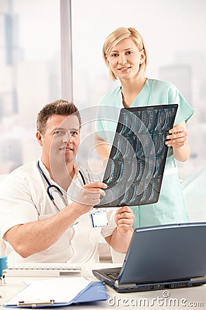 Portrait of doctor and nurse in office