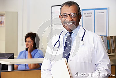 Portrait Of Doctor At Nurses Station