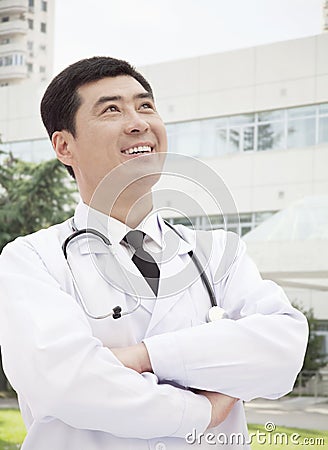Portrait of Doctor Standing With Arms Crossed
