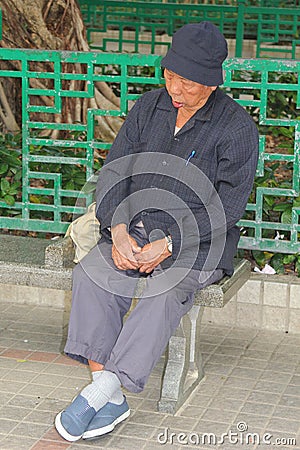 Portrait of an elderly sleeping man in Hongkong