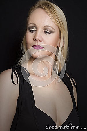Portrait of elegant mature woman in black dress.