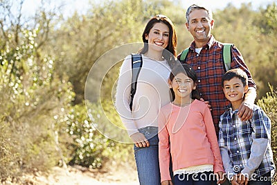 Portrait Of Family Hiking In Countryside