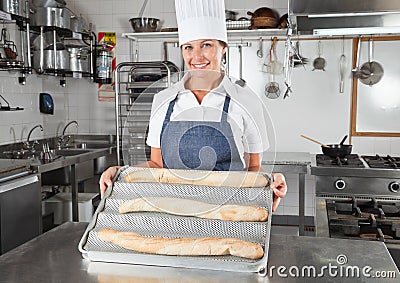 Female Chef Presenting Baked Breads