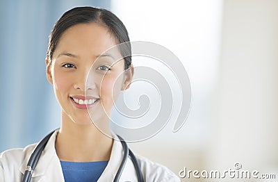 Portrait Of Female Doctor Smiling In Clinic