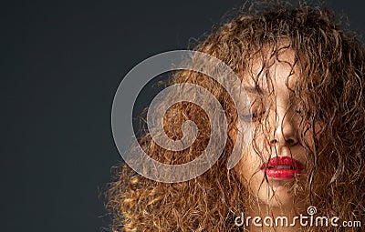 Portrait of a female fashion model with hair and eyes closed