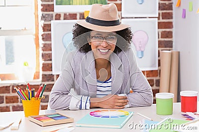 Portrait of female interior designer at desk