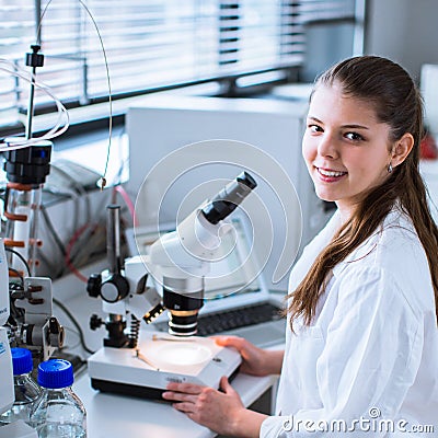 Portrait of a female researcher carrying out research in a chemistry lab