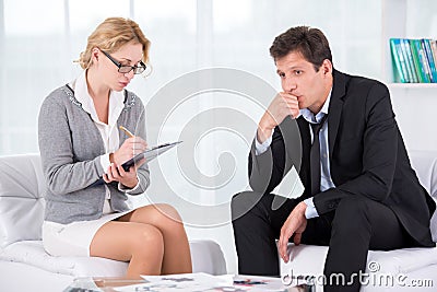 Portrait of female therapist in office with her