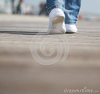 Portrait of a female walking in comfortable white shoes