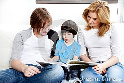 Portrait of friendly family reading book