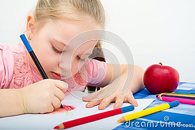 Portrait of girl drawing with pencils