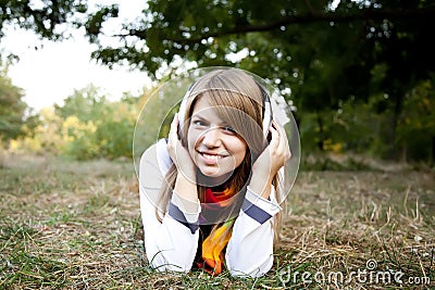 Portrait of girl with headphones at outdoor.