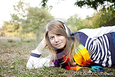 Portrait of girl with headphones at outdoor.