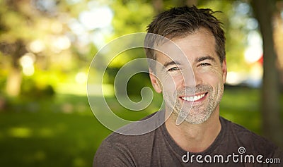 Portrait Of A Handsome Man Smiling At The Camera