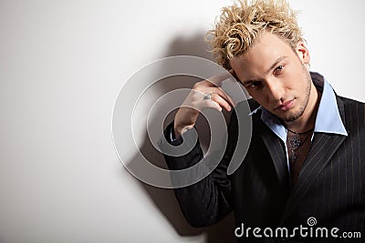 Portrait of handsome stylish blond man in suit