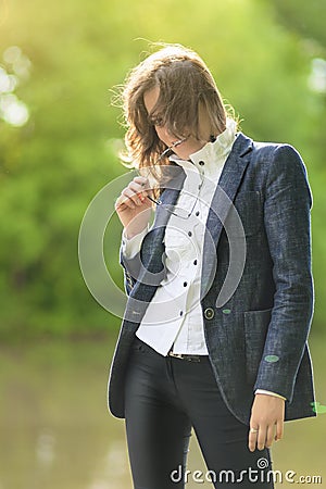 Portrait of Happy Beautiful Brunette Model Over Nature Backgrou