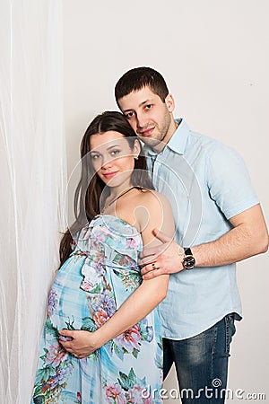 Portrait of happy couple expecting a baby