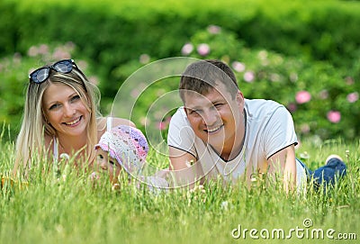 Portrait Of Happy Family In Garden